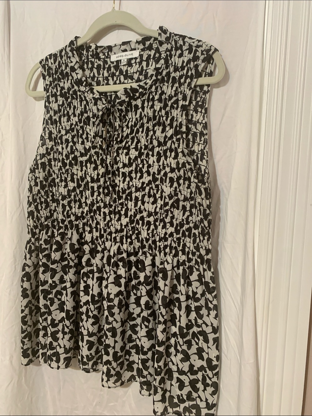 Rose & Olive Black and White Smocked Tie-Neck Peplum Top